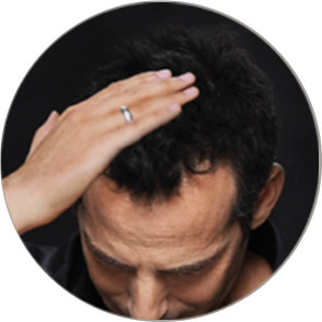 Smoothing out product into the hair